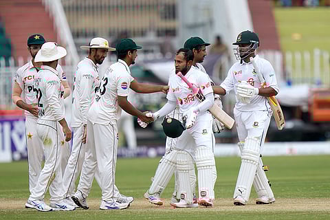 Pakistan vs Bangladesh 2nd Test Day 5: Bangladesh's Mushfiqur Rahim, second right, and Shakib Al Hasan, right, shake hand with Pakistani players